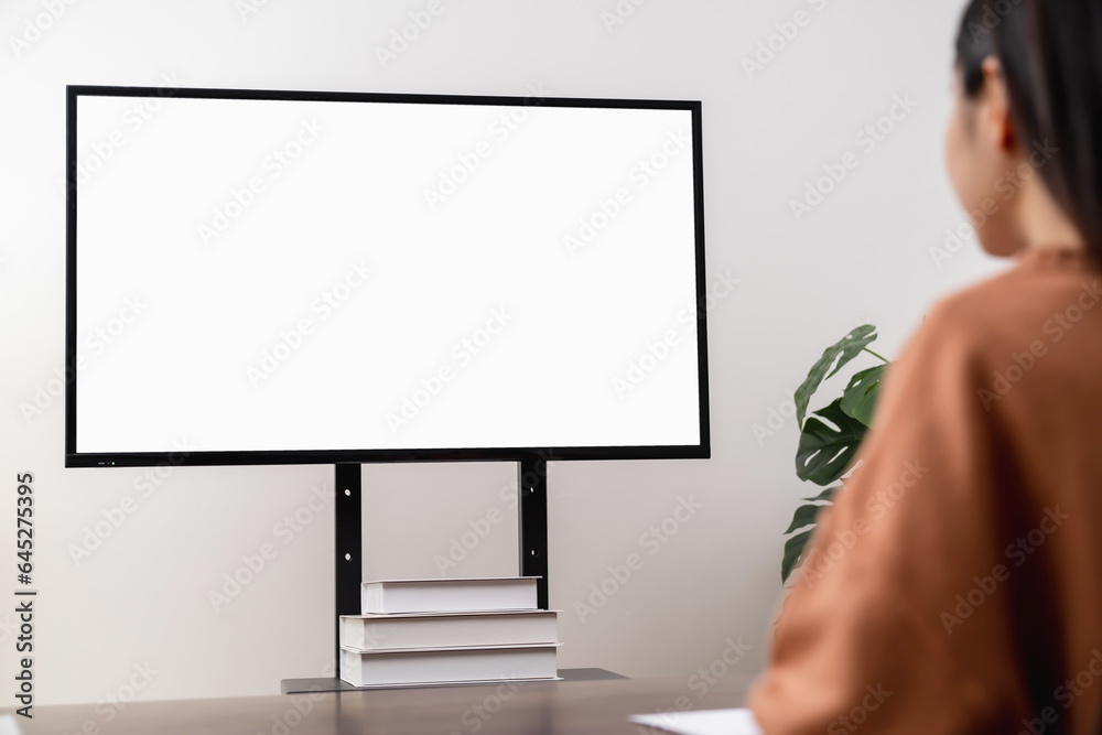 Fototapete Woman using computer and type on the keyboard. Mockup screen of advertisement.