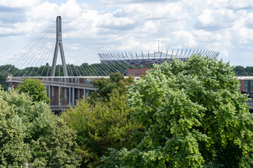 View of the stadium. Bridge over the Vistula river. City traffic. Urban landscape. Panorama view. Cloud sky. Warsaw, Poland.