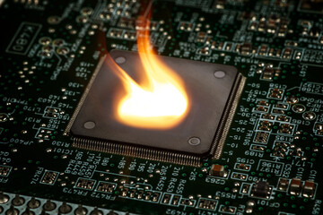 Fire burning micro chip on circuit board with electronic