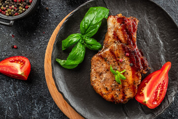 Grilled pork steaks, pork neck with herbs and spices, Restaurant menu, dieting, cookbook recipe top view