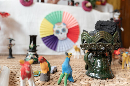 A ceramic copal globet is decorating a Day of the Dead sleeping mat