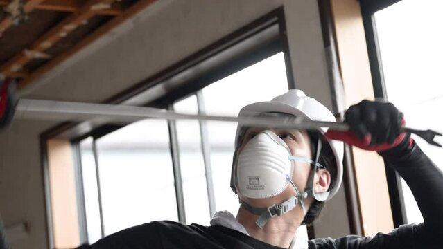 Video of a demolition contractor working with a crowbar