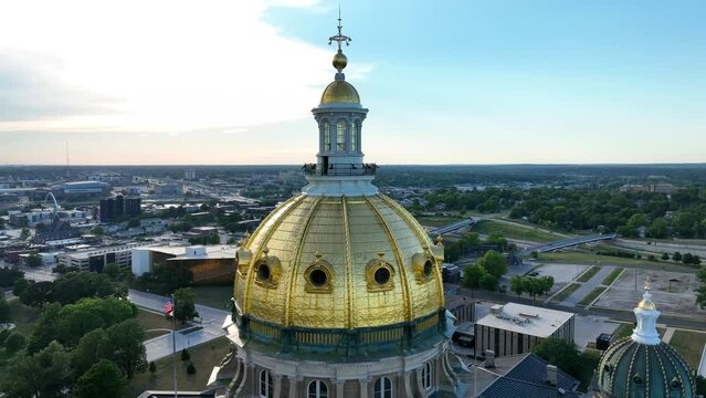 Des Moines, Iowa capitol dome. Aerial orbit at sunset. Government theme in Iowa. Iowa Caucuses for presidential elections.