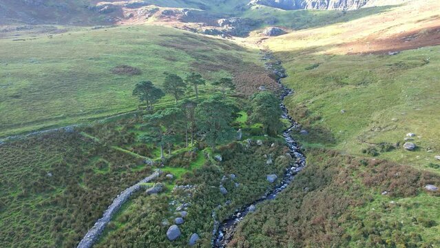 Ireland Comeragh Mountains a farm homestead on the side of the mountains Ned Currans Cottage on a summer evening
