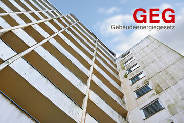 Old high-rise building and German Gebäudeenergiegesetz (GEG), meaning Building Energy Law, heating systems must be largly powered by renewable energy and older buildings must be insulated - 645285987