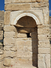 An ancient stone construction. The structure is built from massive blocks of rock and sits quietly.