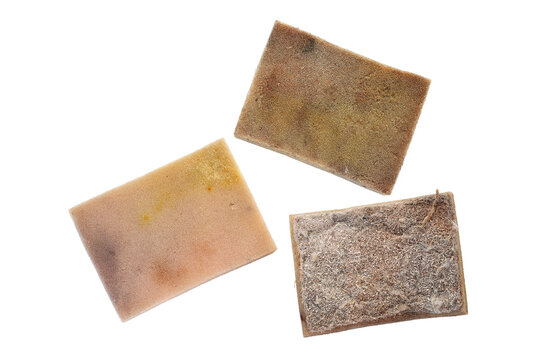 Old dirty dish washing sponge with worn out surface used to clean in kitchen, top view of three unclean sponges isolated on white background