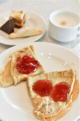 Breakfast - pancakes with jam and coffee