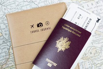 French and European passports, a boarding pass, and a travel book, all displayed against a map backdrop.