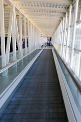 Long travelator moving walkway in an airport.