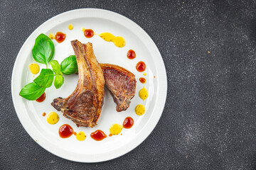 lamb cutlet on the bone fresh meat portion food ready to eat healthy appetizer meal food snack on the table