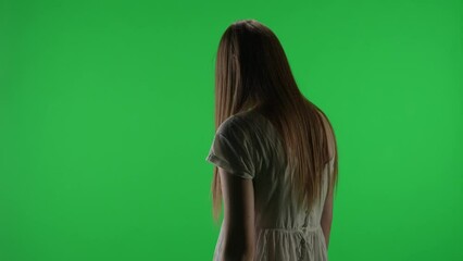 Medium half turn green screen, chroma key video of a posessed female figure, ghost, poltergeist, zombie raising, pulling out a knife, stabbing the air. Chroma key.