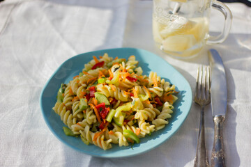 Pasta salad with fresh vegetables.