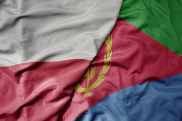 big waving national colorful flag of poland and national flag of eritrea .