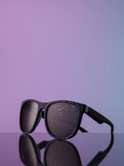 sunglasses on a blue gradient background
