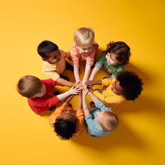 Children join hands in a circle. Boys and girls smiling and having fun various nationalities cooperate in activities. harmonious, team work, equality. Top view.