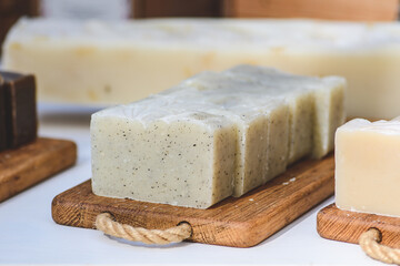 Organic handmade soap on a wooden board in a folk arts and crafts fair or market