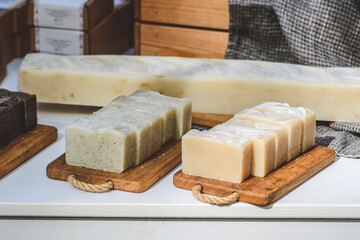 Organic handmade soap on a wooden board in a folk arts and crafts fair or market