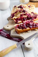 Cherry pie on a wooden cutting board. Homemade cherry pie. wooden background.