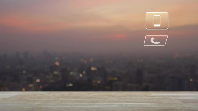 Modern smart mobile phone, telephone, www, and email buttons on wooden table over blur of cityscape on warm light sundown, Business customer service and support online concept