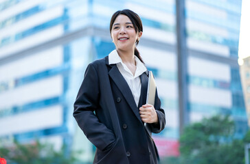 Asian businesswoman walking on the street