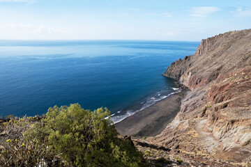 La playa de las Gaviotas, popular nudist beach with black volcanic sand in Tenerife. View from the top