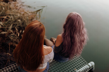 Women with long hair on lake shore