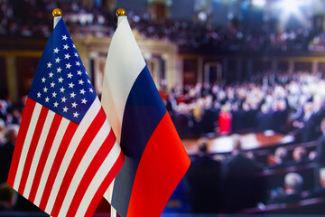 The US flag, Russian flag with copy space for text. Flag of USA, flag of Russia. The United States of America and the Russian Federation confrontation. Russia's invasion of Ukraine - obrazy, fototapety, plakaty