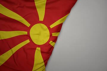 big waving national colorful flag of macedonia on the gray background.