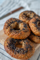 home made whole grain Bagels with cheese on a table