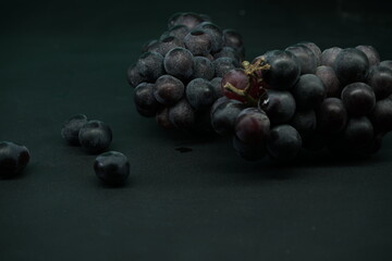 Bunch of wine grapes with black background