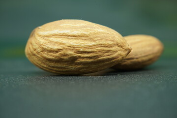 Almonds ,close up view on black bakground