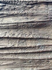 Grooves in a grayish brown metal surface