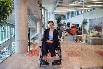 In a modern office, a young businesswoman in a wheelchair is surrounded by her supportive colleagues, embodying the spirit of inclusivity and diversity in the workplace