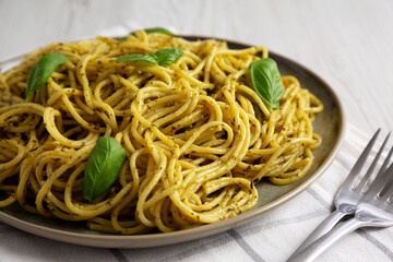Homemade Vegan Pesto Pasta on a Plate, side view. Close-up.