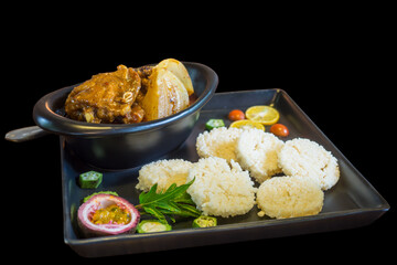 isolate black background with crispy rice and roasted chicken