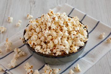 Homemade Buttered Popcorn with Salt in a Bowl, side view.