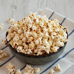 Homemade Buttered Popcorn with Salt in a Bowl, side view.
