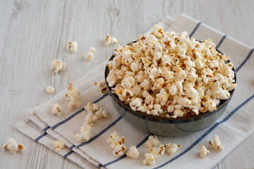 Homemade Buttered Popcorn with Salt in a Bowl, side view.