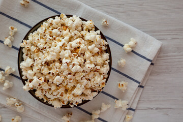 Homemade Buttered Popcorn with Salt in a Bowl, top view. Flat lay, overhead, from above. Copy space.