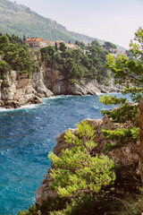 Fototapeta na wymiar Dubrovnik, Croatia, 2023: Dubrovnik Coastline, Rocks. Mediterranean Coast, Adriatic Sea. Bellevue Beach