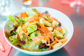 Smoked salmon salad with lettuce, walnuts and avocado, healthy food concept