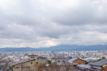 Fototapeta na wymiar The distant mountains provide a sense of grandeur and tranquility view of the heart of Kyoto.