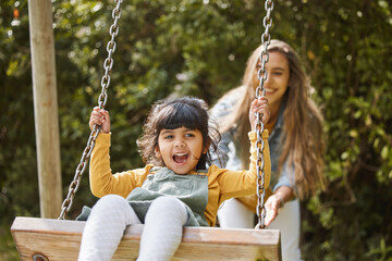 Happy, swing and mother and child in park for playing, bonding and having fun together outdoors....