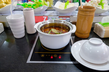 Sichuan Hotpot Delights: Mock-up Table Set with Ready-to-Eat Sichuan-style Hotpot