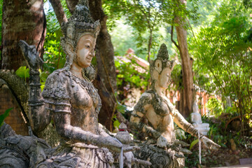 Statue of Phraya Thammikaraj, the Enlightened Spirit Embodied in Buddhist Deities in Forest temple
