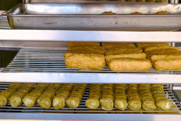 Hoi jo Crab Meat ball and Crispy prawn and tofu skin ball are being placed on a tray for sale.