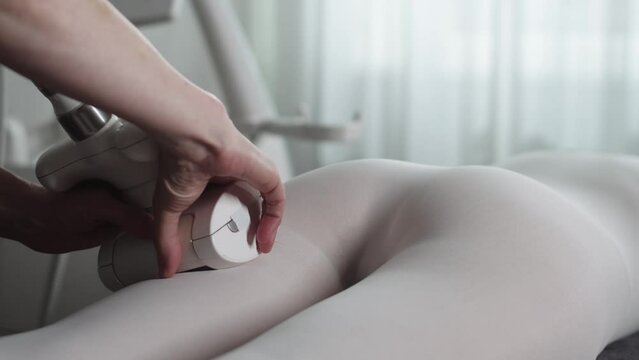 LPG massage - massaging of woman in white suit