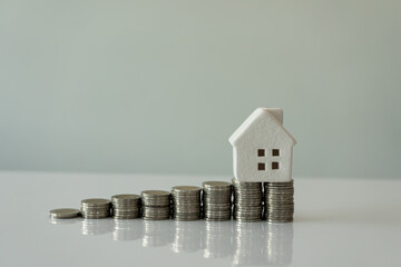 Interest Rates for Home Business and Home Savings for Home Ideas Added stacked coins and house...