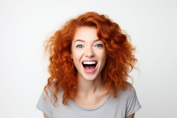 Portrait of beautiful surprised cheerful redhead girl